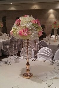 Crystal garlands gold stands with florals centerpieces